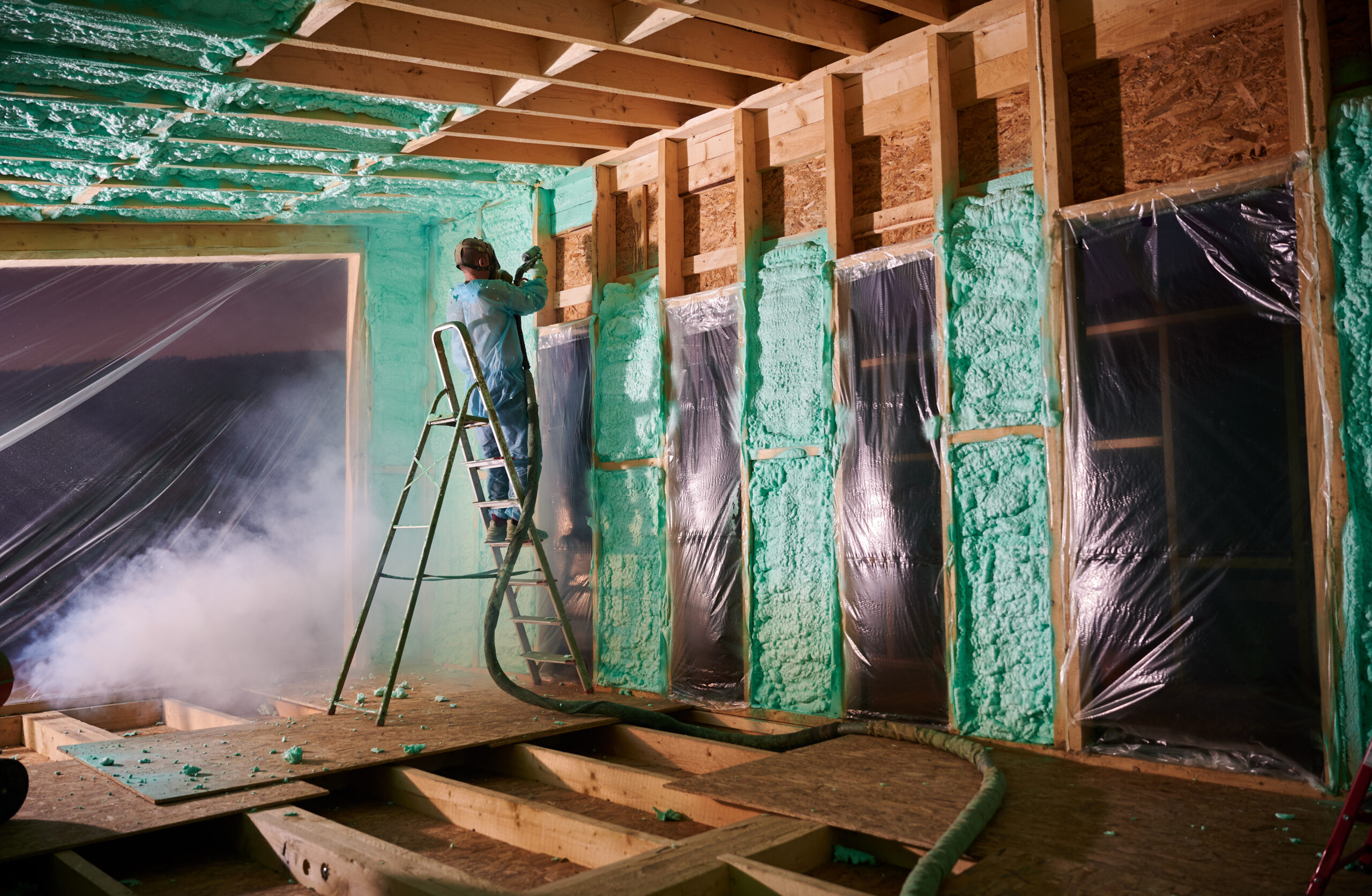 worker spraying polyurethane foam for insulating w 2023 11 27 05 18 42 utc scaled